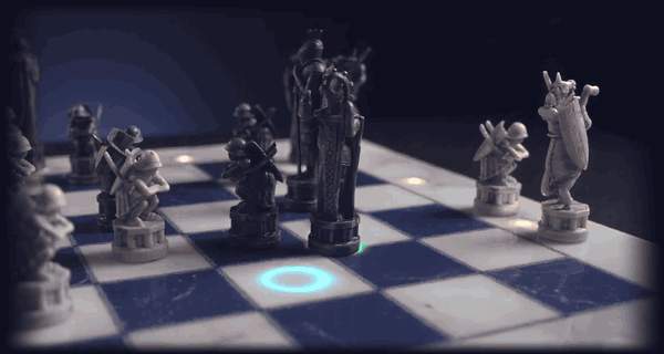 A lit square waits, the queen crosses the board on her own, and the ring beneath her turns green